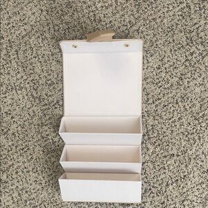 Elegant tan sunglasses case.  Holds 3 pair of sunglasses.  Never used.